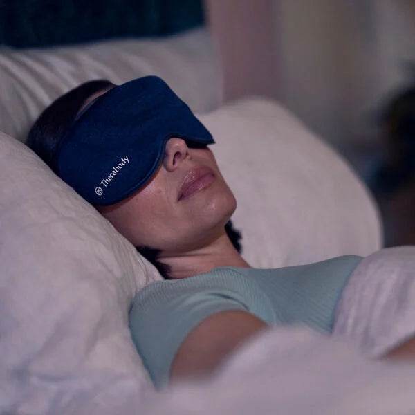 Woman using SleepMask with vibration to sleep 